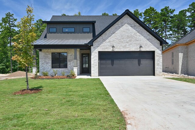 view of front of home with a garage, central air condition unit, and a front lawn