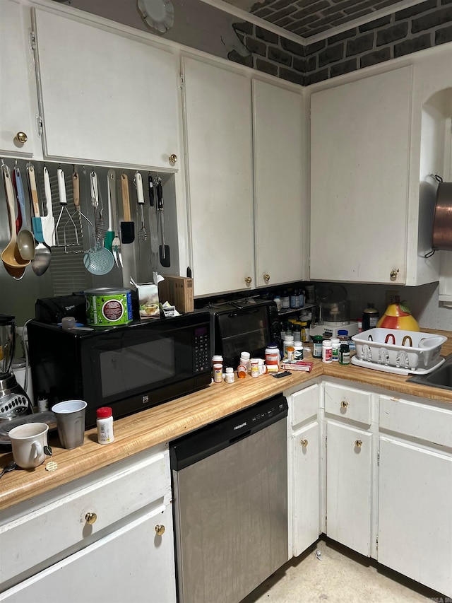 kitchen featuring stainless steel dishwasher and white cabinetry