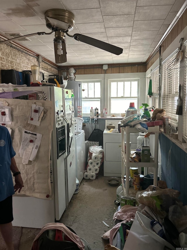 misc room featuring washer and dryer and ceiling fan