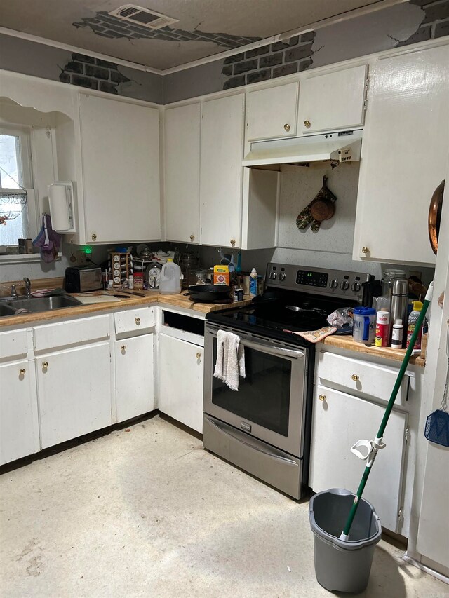 kitchen featuring white cabinetry, electric range, and sink