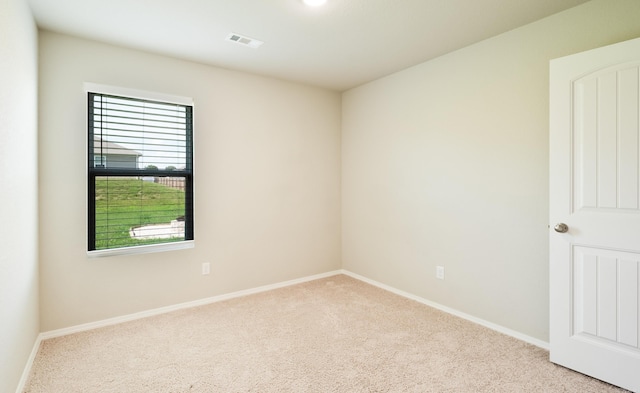 spare room with light carpet