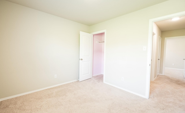 unfurnished bedroom with light carpet