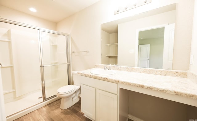 bathroom with vanity, an enclosed shower, wood-type flooring, and toilet