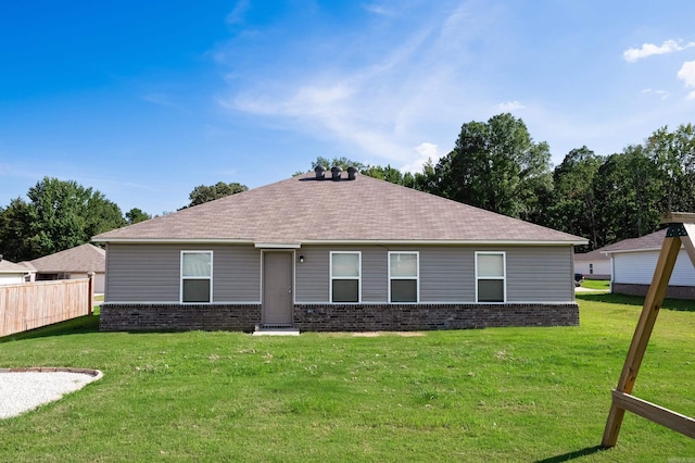 ranch-style house featuring a front lawn