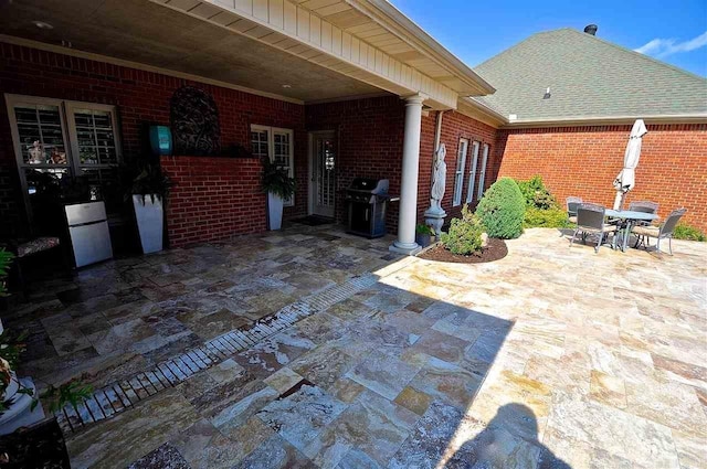 view of patio featuring a grill