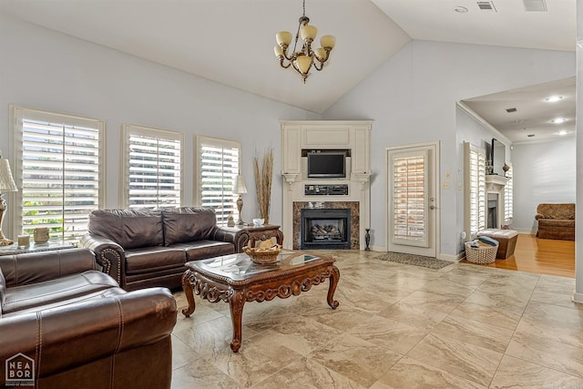 tiled living room featuring an inviting chandelier and high vaulted ceiling