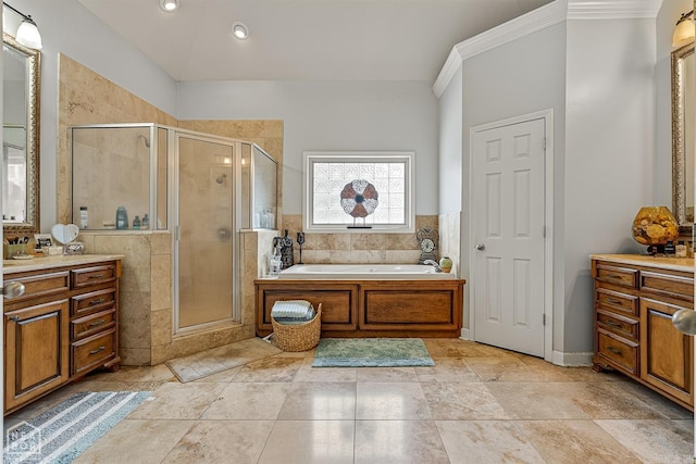 bathroom with tile patterned flooring, shower with separate bathtub, and vanity