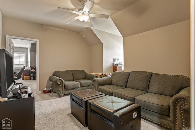 carpeted living room with lofted ceiling and ceiling fan