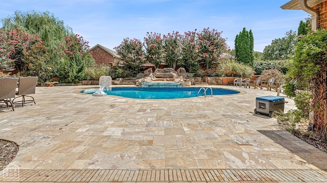 view of swimming pool featuring a patio area