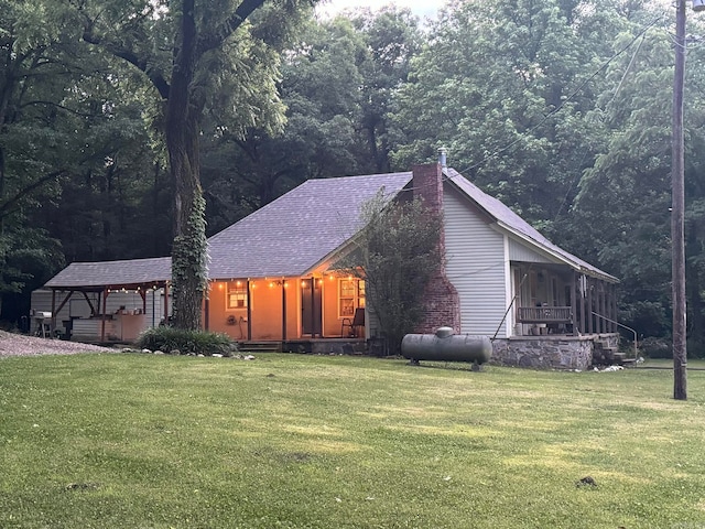 view of side of property with a yard