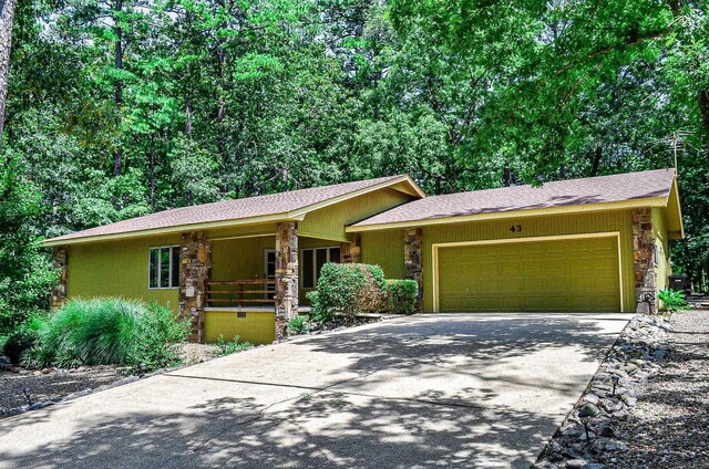 ranch-style home featuring a garage