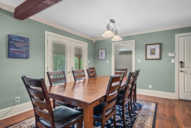 dining space with dark wood-style floors, french doors, ornamental molding, and baseboards