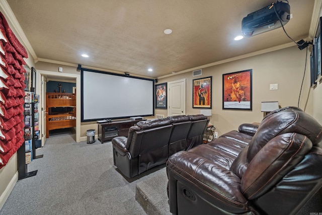 home theater with crown molding, recessed lighting, visible vents, carpet flooring, and a textured ceiling