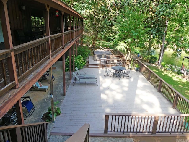 view of patio with stairs and outdoor dining space