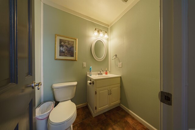 bathroom featuring tile patterned floors, toilet, and vanity