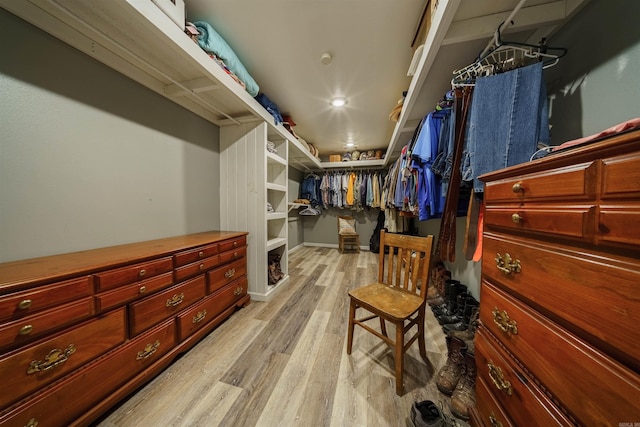 walk in closet with light wood-type flooring