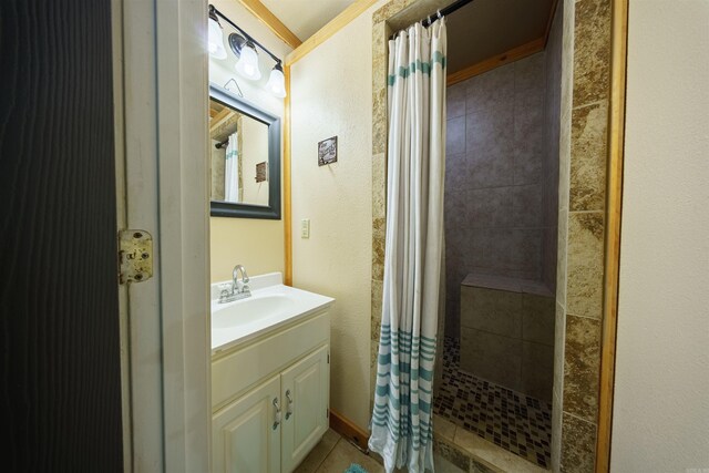 bathroom featuring vanity, crown molding, a shower with curtain, and tile patterned floors