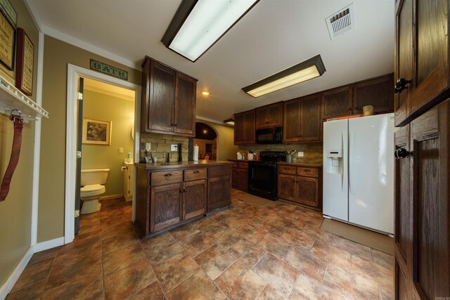 kitchen featuring decorative backsplash, tile patterned flooring, and black appliances