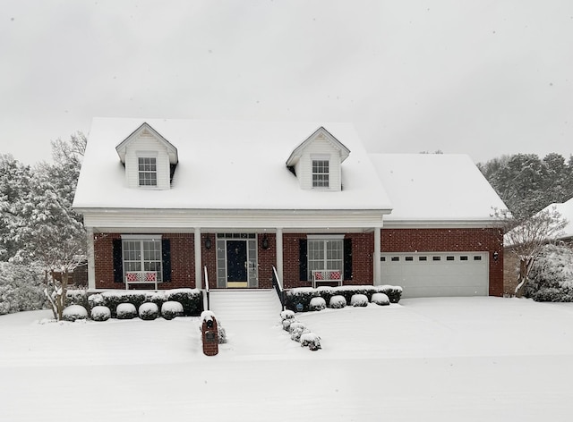 cape cod house featuring a garage