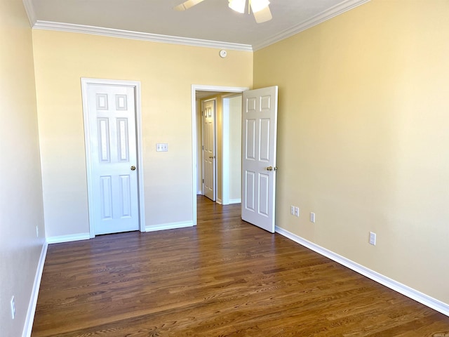 unfurnished bedroom featuring ornamental molding, dark wood-type flooring, and ceiling fan