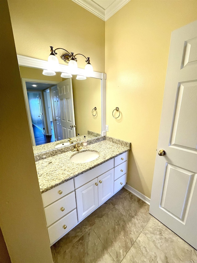 bathroom with vanity and ornamental molding