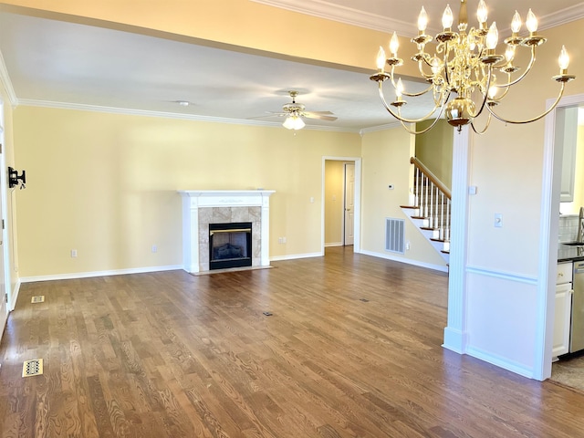 unfurnished living room with sink, crown molding, hardwood / wood-style flooring, ceiling fan, and a fireplace