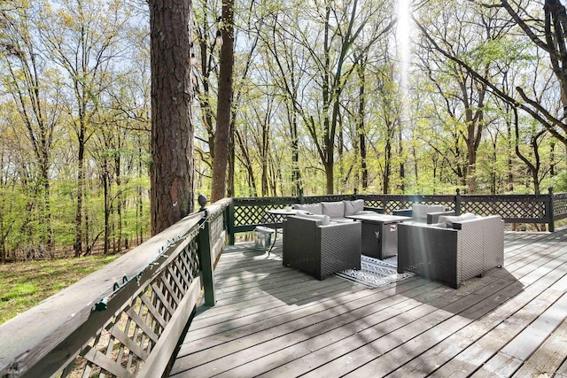 wooden deck featuring an outdoor hangout area