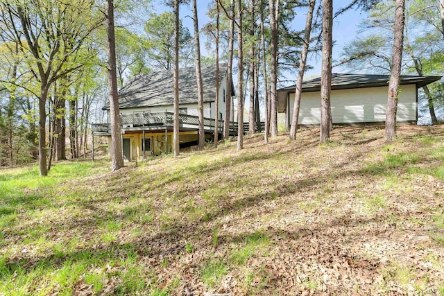 view of yard featuring a wooden deck