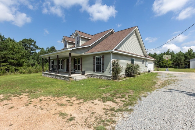 view of home's exterior featuring covered porch and a lawn