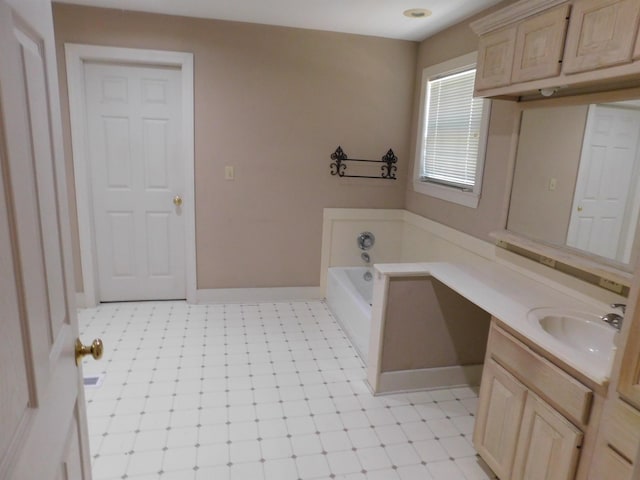 bathroom with vanity and a washtub