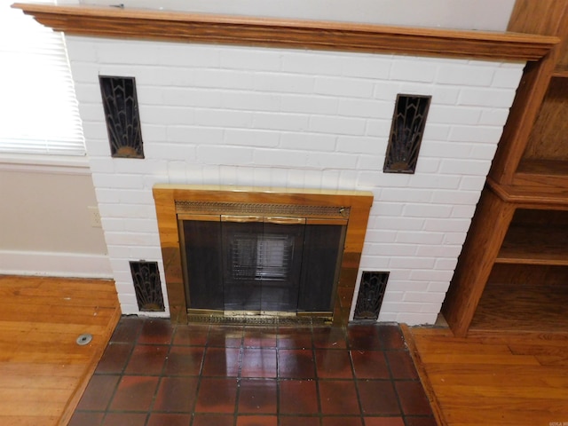 details featuring a brick fireplace