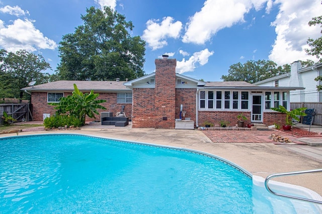 view of swimming pool featuring a patio