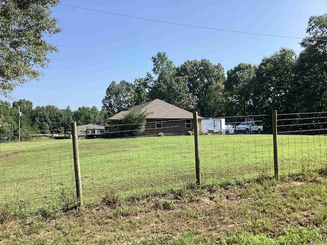 view of yard with a rural view