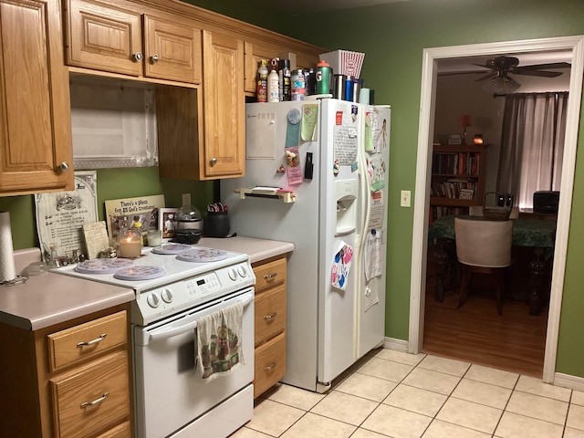 kitchen with ceiling fan, white appliances, and light tile patterned floors