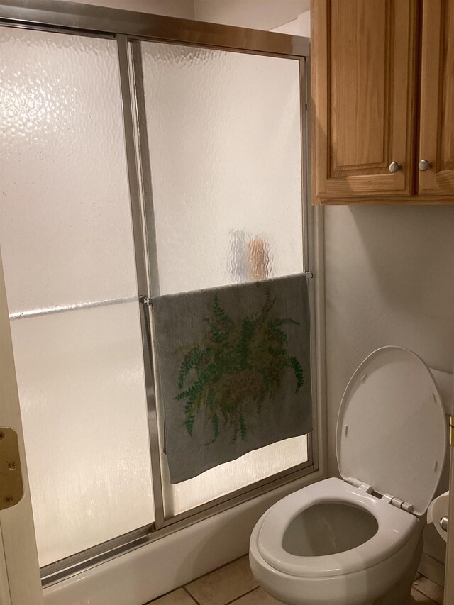 bathroom featuring tile patterned floors and toilet