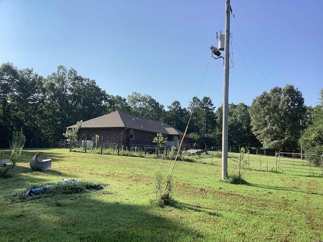 view of yard with a rural view