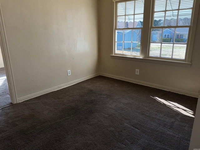 spare room with carpet flooring and a wealth of natural light