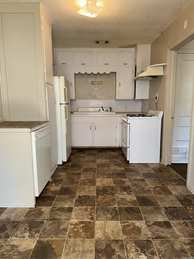 1107 Reynolds St, Clarksville, AR 72830 - kitchen featuring under cabinet range hood, a textured ceiling, white cabinets, and white appliances