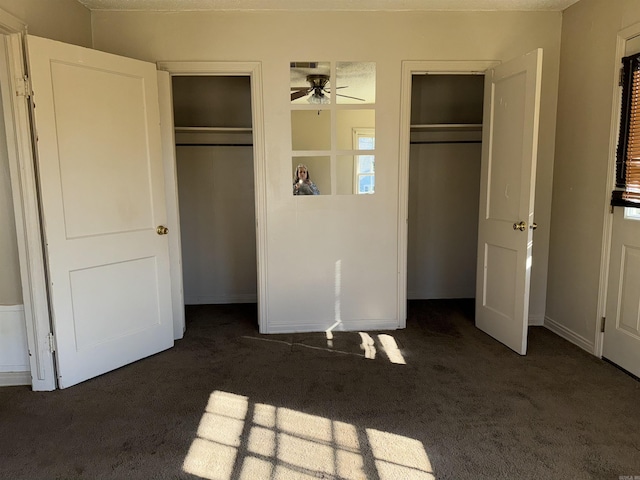1107 Reynolds St, Clarksville, AR 72830 - unfurnished bedroom with carpet flooring and two closets