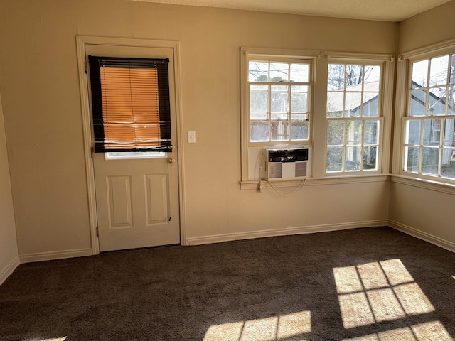 1107 Reynolds St, Clarksville, AR 72830 - doorway to outside featuring carpet and baseboards