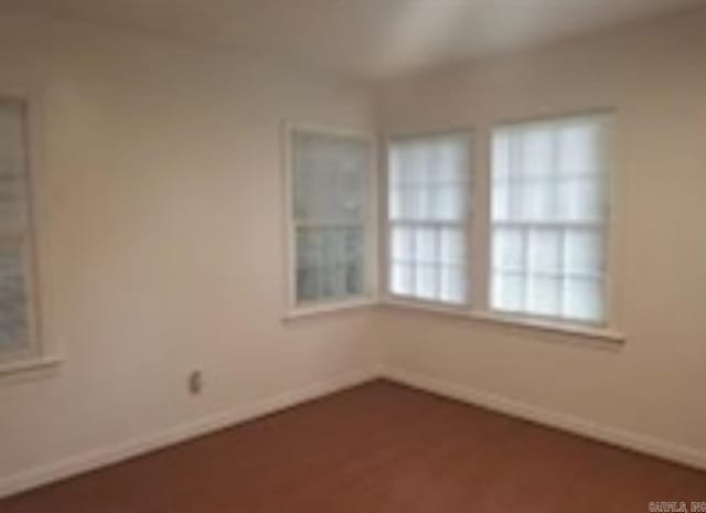 1107 Reynolds St, Clarksville, AR 72830 - spare room featuring baseboards