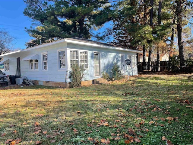 view of home's exterior with a lawn