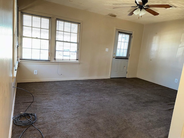 unfurnished room with carpet flooring and ceiling fan