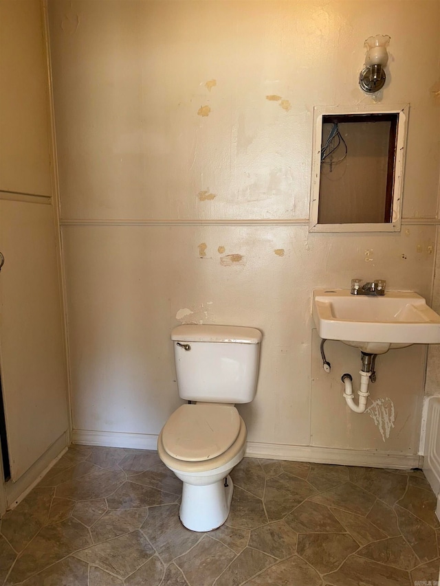 bathroom with sink, tile patterned flooring, and toilet