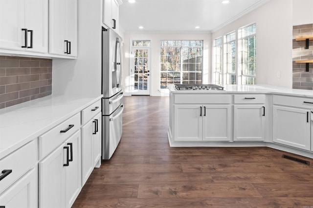 unfurnished living room featuring built in shelves, dark hardwood / wood-style flooring, and a tile fireplace