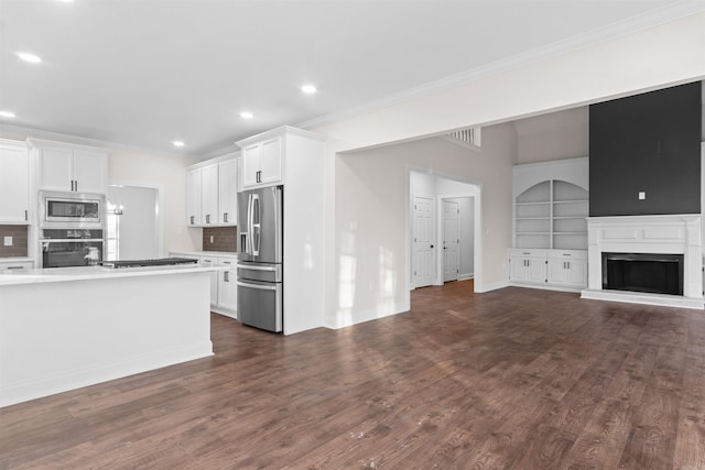 interior space with white cabinets, french doors, a towering ceiling, and dark wood-type flooring