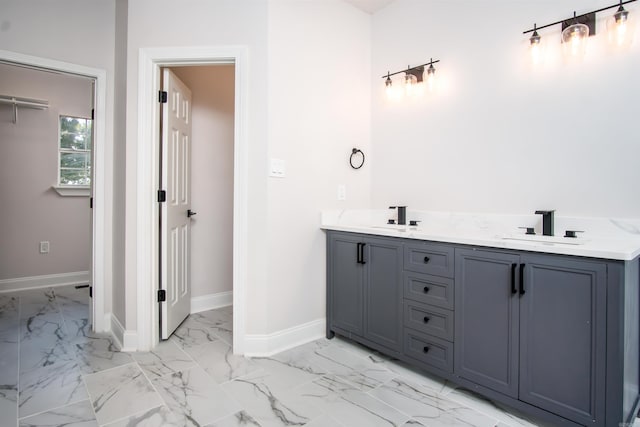 bathroom featuring tile patterned flooring and dual bowl vanity