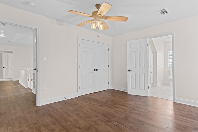 bathroom with tiled shower / bath, ceiling fan, hardwood / wood-style flooring, and lofted ceiling