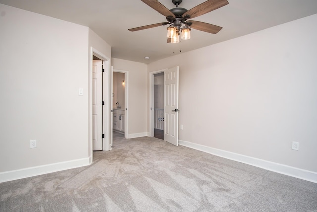 unfurnished bedroom featuring light carpet and ceiling fan