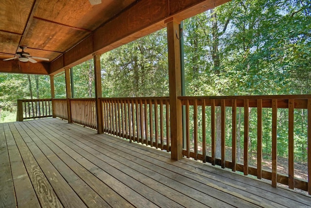 wooden deck featuring ceiling fan